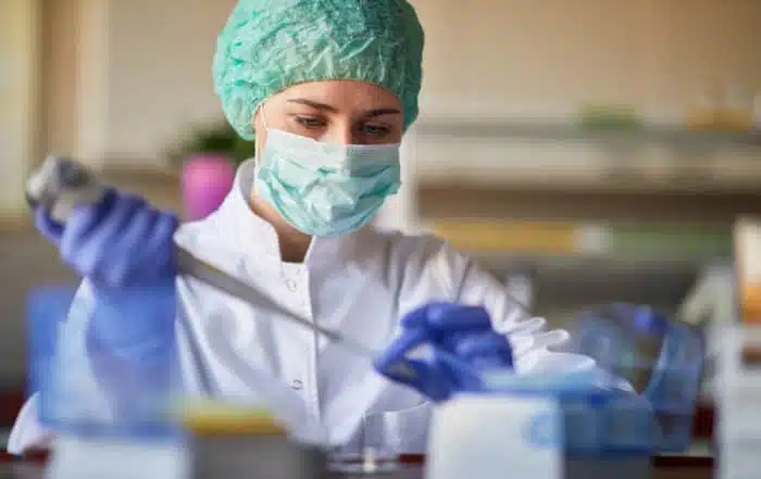 female scientict making research in lab analyzing a new virus. corona virus concept